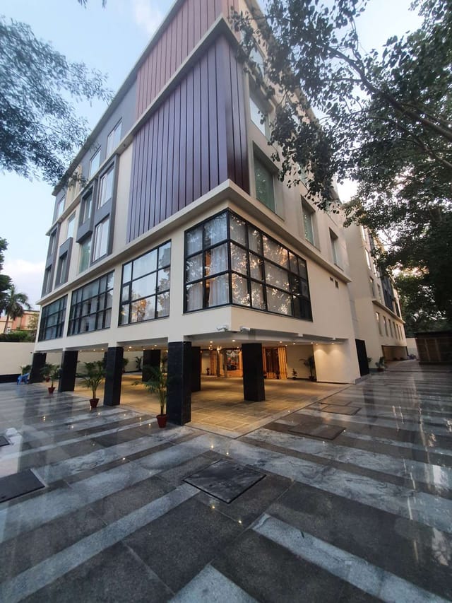 Modern meeting room with large windows at Best Western Maharani Bagh for events.