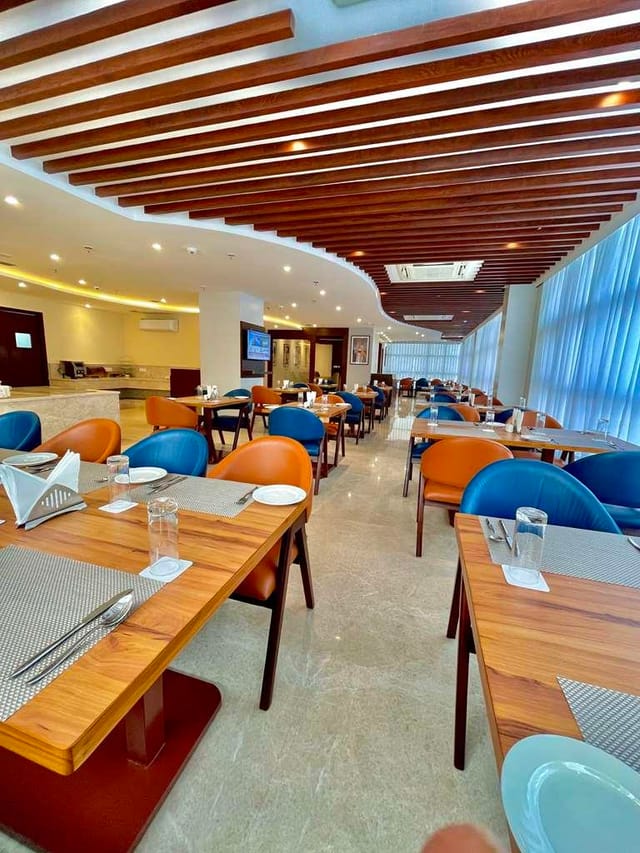 Modern meeting room with natural light at Best Western Maharani Bagh for events.