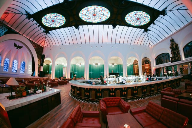 Elegant lounge with stained glass, perfect for upscale events and gatherings.