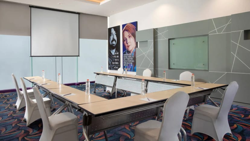 Meeting room at Hotel Arwana with clear table setup for productive meetings and presentations.