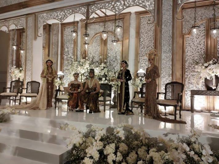 Aria Ballroom Terrace stage with floral decor for stunning wedding or cultural events.