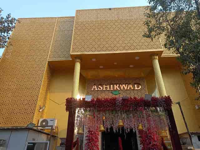 Vibrant Ashirwad Party Hall with floral entrance, ideal for weddings and celebrations.