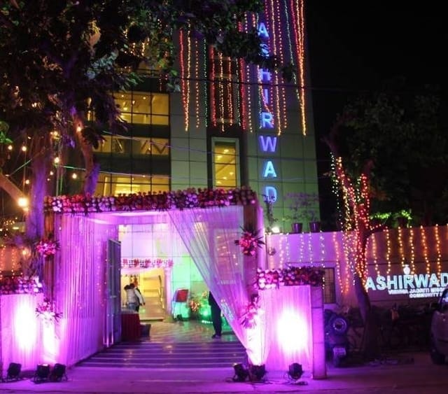 Elegant banquet hall entrance with floral decor, ideal for weddings and corporate events.