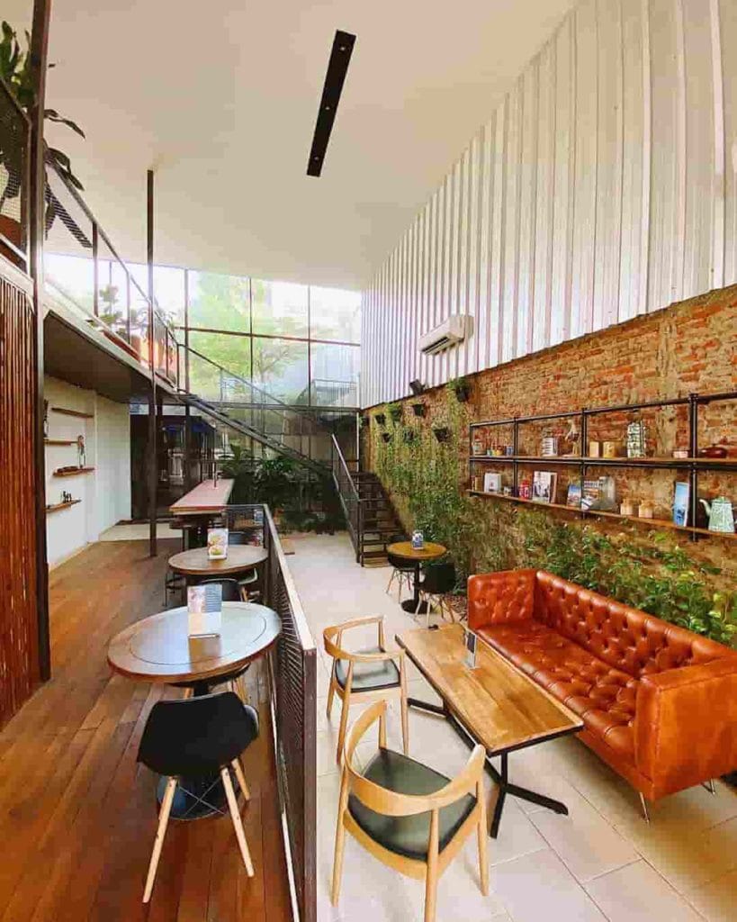 Modern restaurant in Rumanami Residence with exposed brick, cozy for gatherings and meetings.