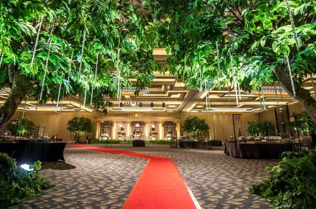 Grand Ballroom at Sheraton Grand Jakarta: lush greenery, luxurious venue for weddings and events.