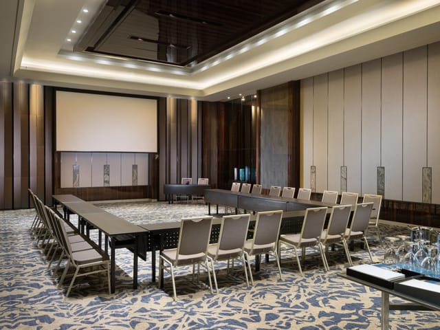 Grand Ballroom at Sheraton Grand Jakarta, modern conference room with elegant decor.