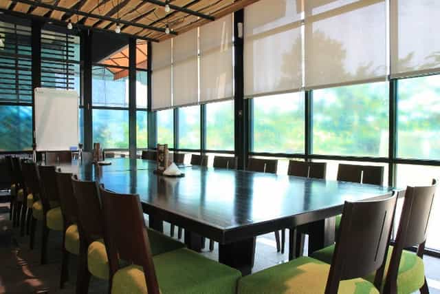 Bintaro Jaya Xchange spacious meeting room with large table, ideal for collaboration and presentations.