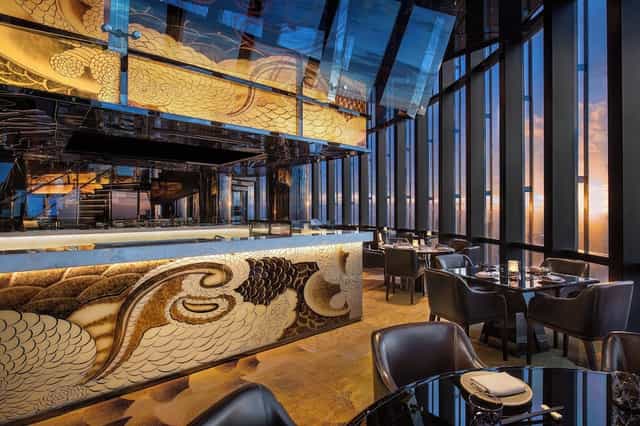 Sleek dining space with floor-to-ceiling windows at The Westin Jakarta for luxury events.