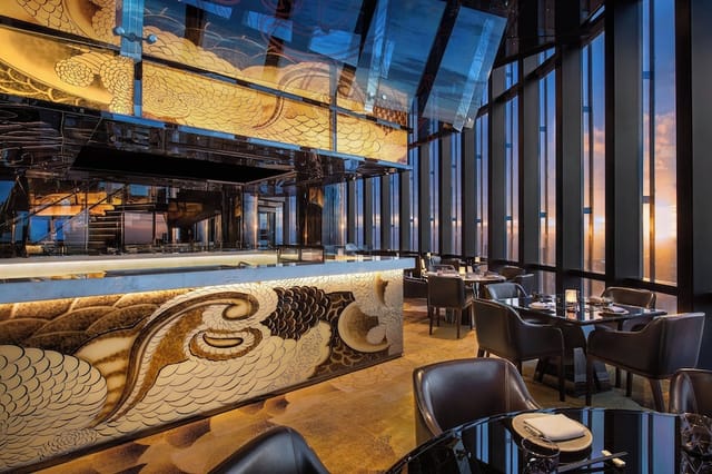 Sleek dining space with floor-to-ceiling windows at The Westin Jakarta for luxury events.
