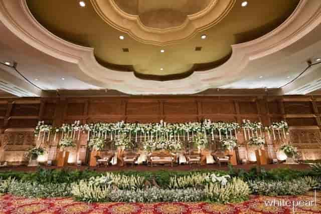 Ritz-Carlton Grand Ballroom with floral stage, ideal for weddings and corporate events.