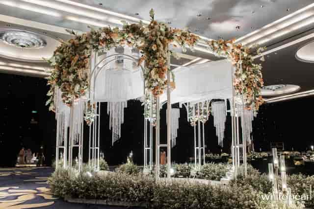 Elegant floral arch with crystals in Dian Ballroom, Raffles Jakarta, perfect for weddings or galas.