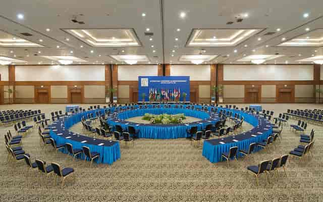 Function room in Jakarta Convention Center with circular seating for large-scale meetings.