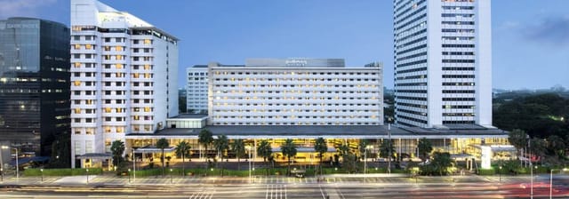 Sleek hotel façade in Pullman Jakarta, ideal for events and conferences with natural light.