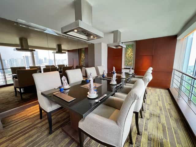 UNA Private Venue meeting room in Jakarta, sleek table, ideal for corporate events and presentations.