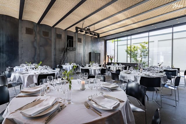 Elegant conference hall with natural light, ideal for corporate events and weddings.
