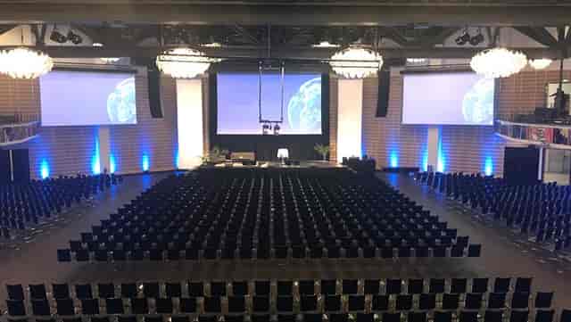 Spacious conference venue in Tivoli Hotel for presentations and networking events.