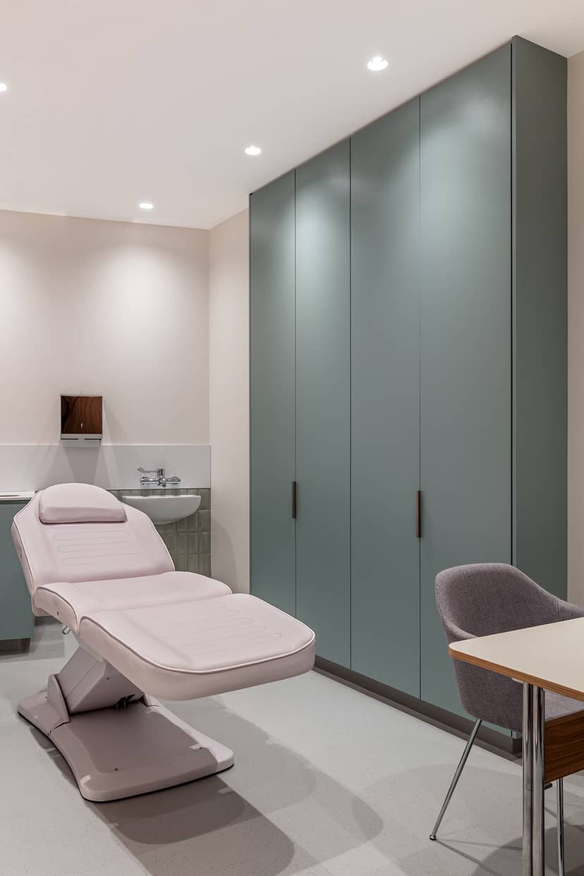 Luxury treatment room with adjustable bed for wellness events and personal care sessions.