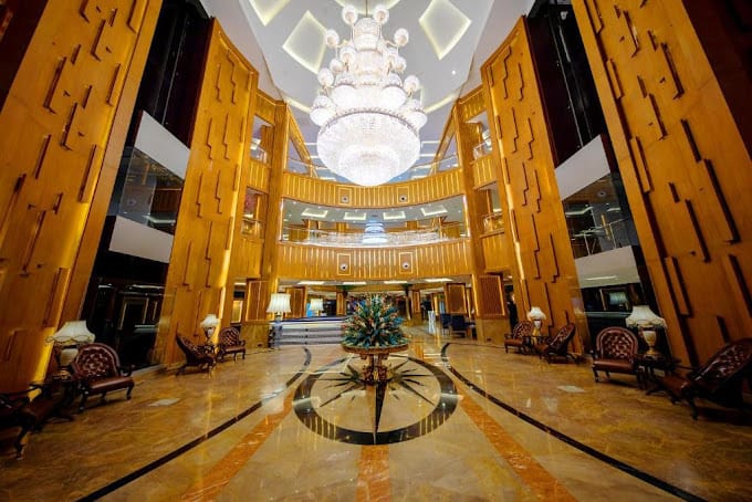 Elegant Aqleem Hall 3 & 4 lobby with chandelier, ideal for upscale events and conferences.