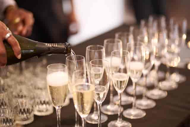 Elegant champagne pouring at West Wing, OXO2 for a sophisticated event celebration.
