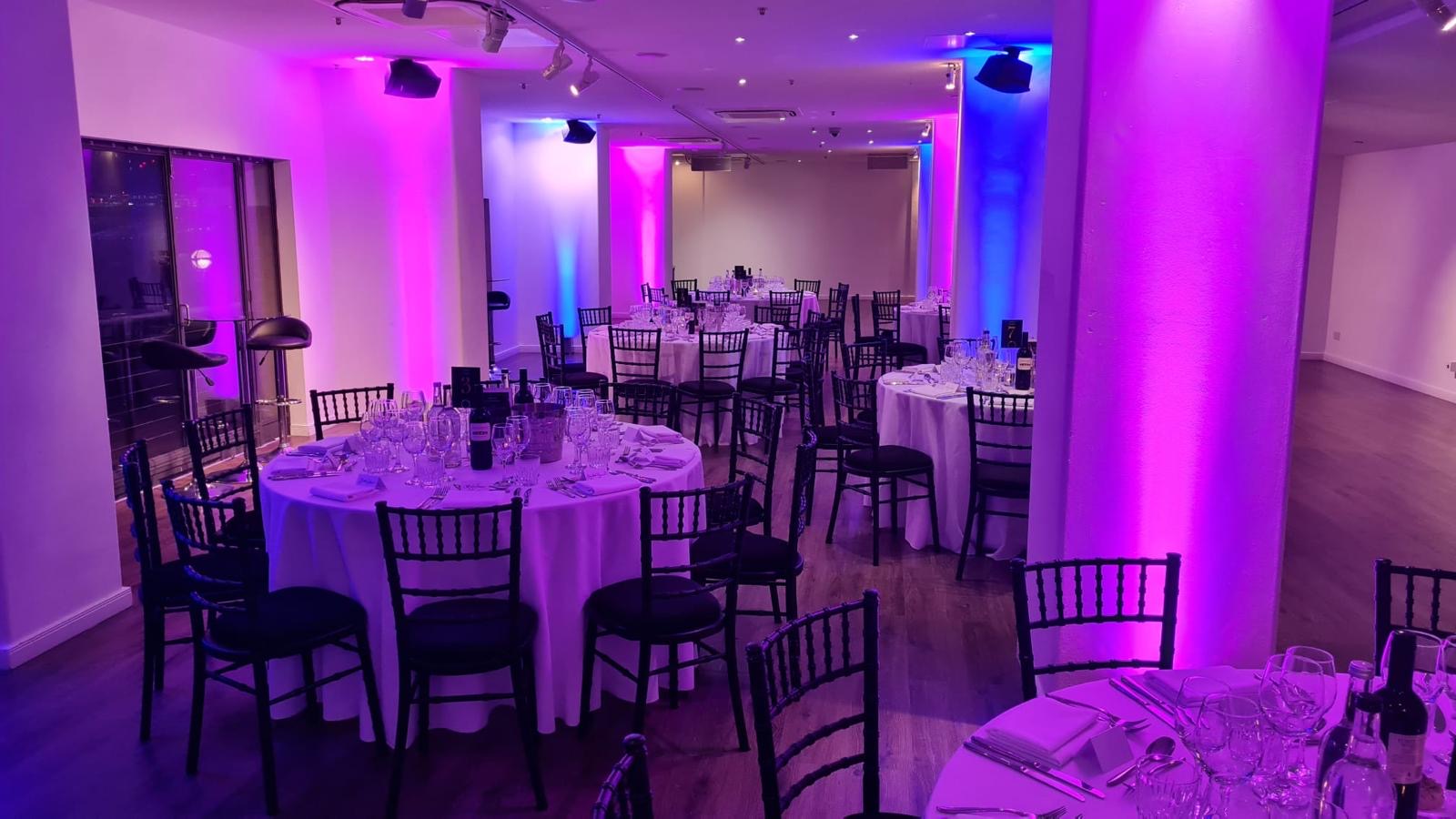 Elegant event space in OXO2 with round tables, ideal for corporate events and weddings. - Banner
