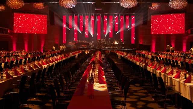 Elegant banquet setup with red accents at Tivoli Hotel for sophisticated events.