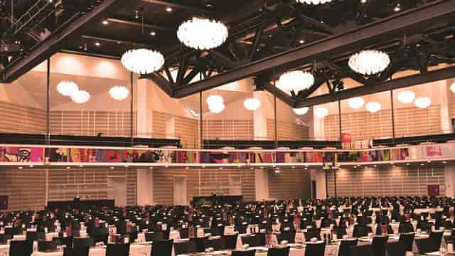 Elegant banquet hall at Tivoli Hotel, featuring black linens for events and gatherings.