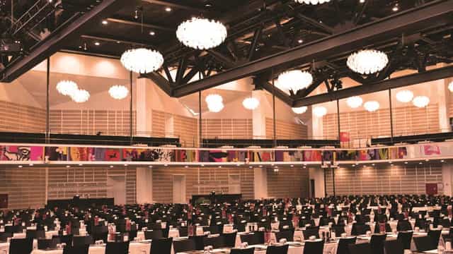 Elegant banquet hall at Tivoli Hotel, featuring black linens for events and gatherings.