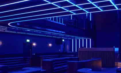 Modern BoTree Ballroom with sleek lines and blue lighting for versatile events.