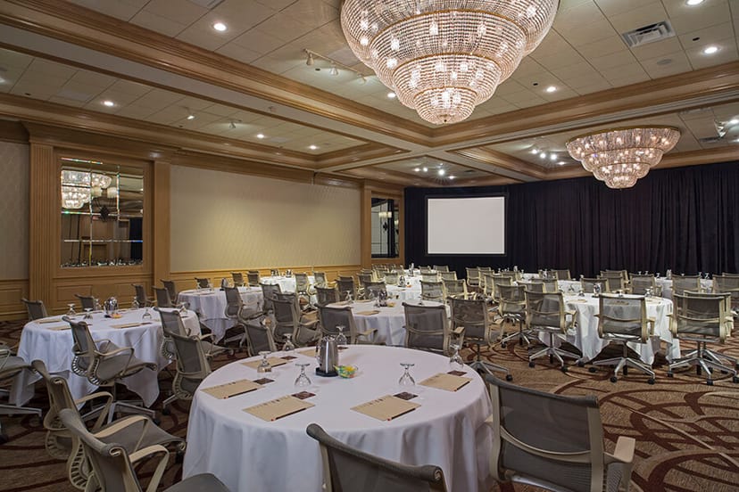 Conference center at The San Luis Resort with elegant tables for professional meetings.