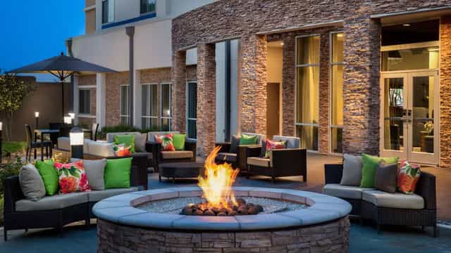 Cypress Meeting Room outdoor space with cozy fire pit for networking events in Houston.