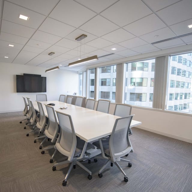 Modern boardroom with ergonomic chairs, ideal for conferences and meetings.