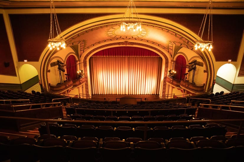 Elegant Brattle Theatre stage with plush seating for performances and corporate events.