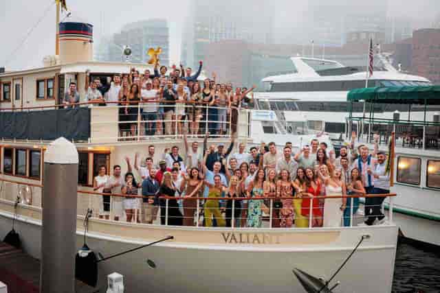 Attendees networking on a chartered boat from Charles River Boat Company.