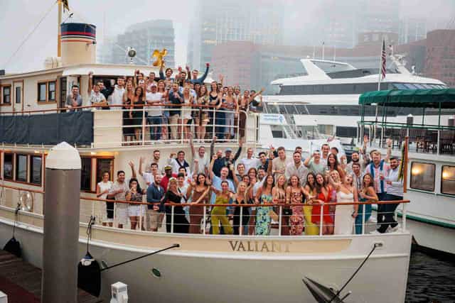 Attendees networking on a chartered boat from Charles River Boat Company.