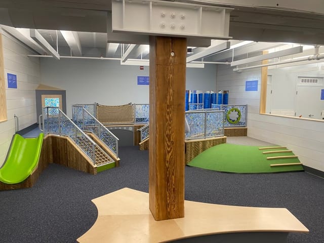Creative event space in Boston Children's Museum with integrated play features for team-building.
