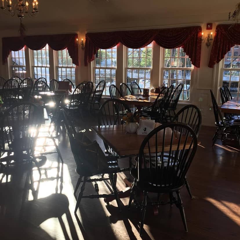 “Abigail’s Tea Room with rustic wooden tables, ideal for intimate events and workshops.”