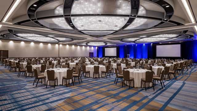Grand Ballroom in SF Bold, elegant space with chandelier, ideal for conferences and banquets.