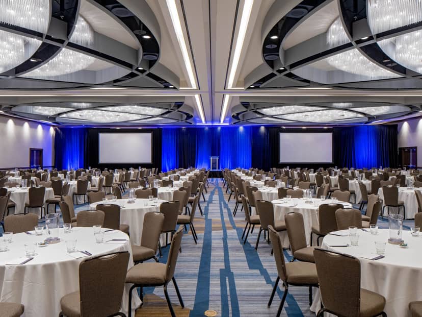 Grand Ballroom SF Bold with elegant tables set for a professional conference or banquet.