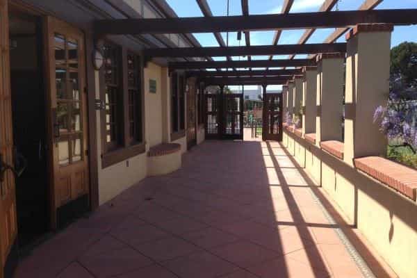 Community Room at Moscone Recreation Center, bright outdoor corridor for events and networking.
