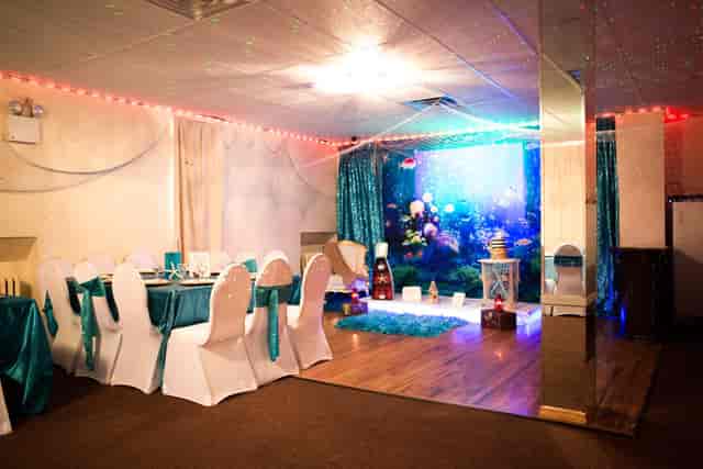 Intimate banquet hall with teal decor for themed parties and receptions
