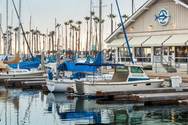 Bar at Bluewater Grill with marina view, ideal for outdoor events and networking.