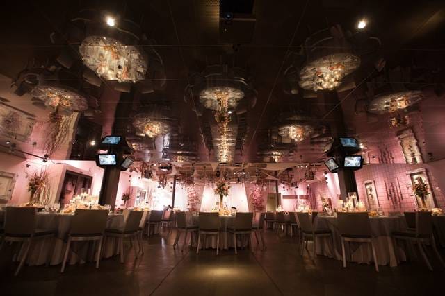 Elegant event venue with ambient lighting, perfect for weddings and upscale gatherings.