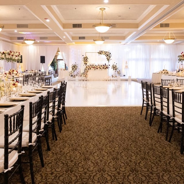 Elegant banquet hall with floral arrangements for weddings and formal events.
