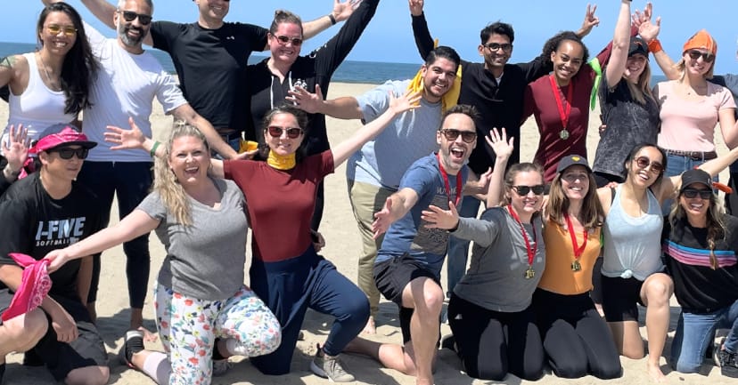 Team-building event at The Arctic Express Retreat, beach setting, fostering camaraderie.