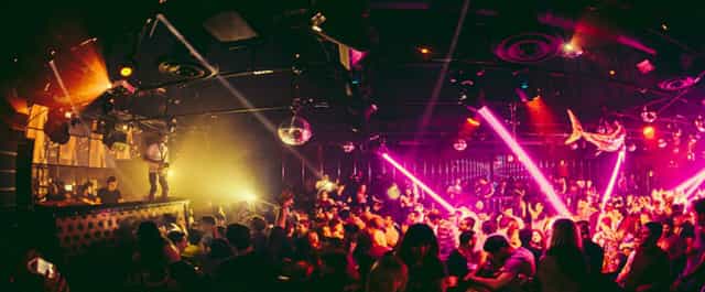 Outdoor patio at Sound Nightclub with vibrant lighting, ideal for energetic nightlife events.