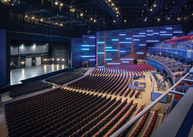 Modern Sugar Land Auditorium with tiered seating for versatile events.