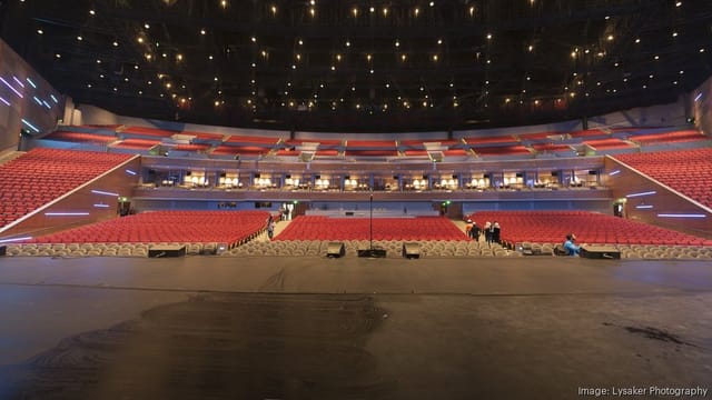Spacious Sugar Land auditorium with tiered seating, perfect for concerts and conferences.