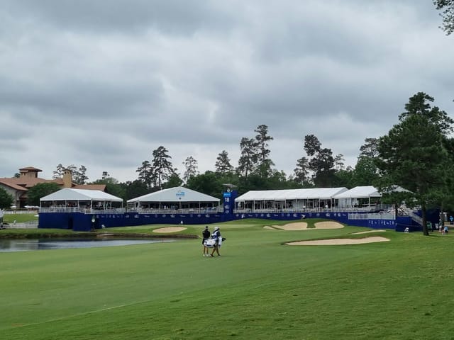 Jack Nicklaus Course outdoor event setup with white tents near a golf course.