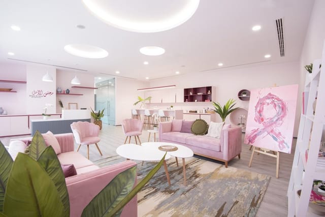 Modern pink-toned boardroom at Al Jalila Foundation for creative meetings and events.