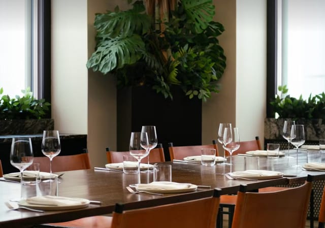 Elegant dining table in Crown Shy, perfect for intimate gatherings and business meetings.